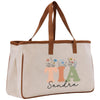 a canvas tote bag with a monogrammed initial