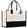 A large tote bag with the word "BRIDE" printed on it in white letters.
