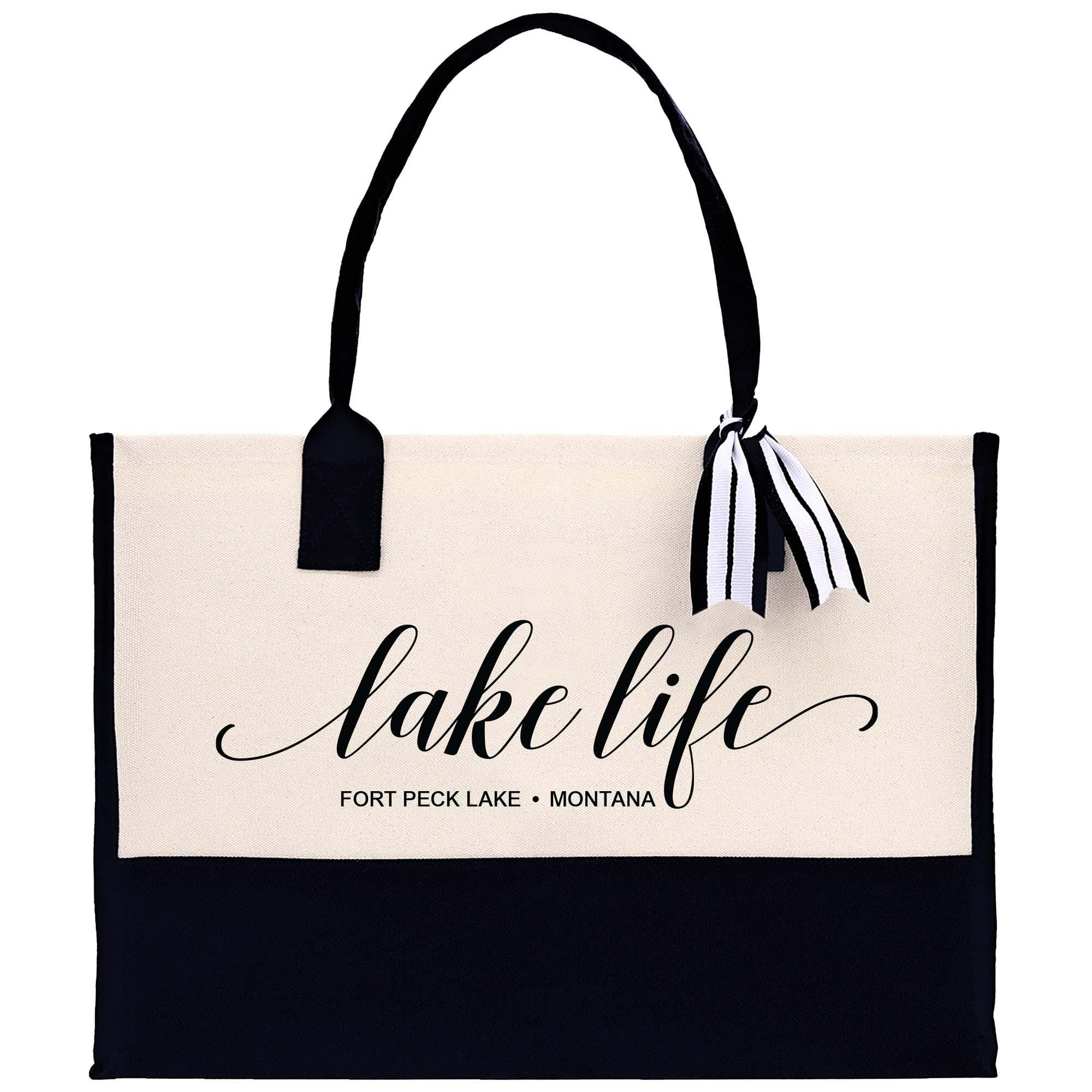 a white and black bag with a black handle