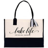 a white and black bag with a black handle