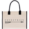 A beige canvas tote bag with the word "EQUESTRIAN" printed on it, along with a black handle and strap.