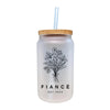a glass jar with a straw in it