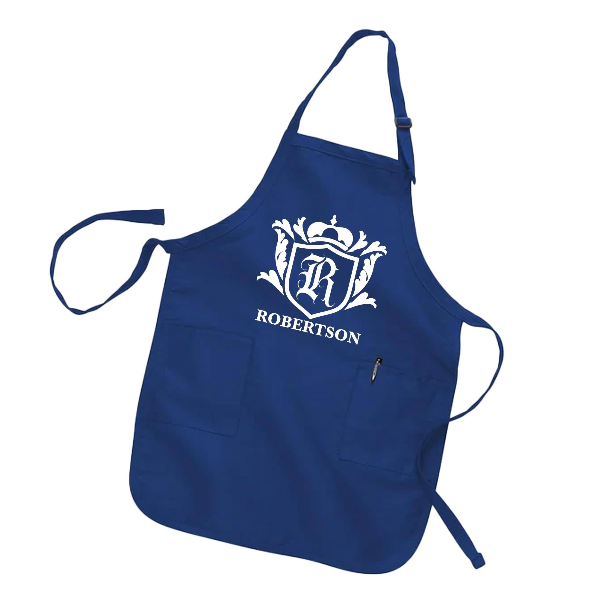 A navy blue apron with a white crest and the text &quot;ROBERTSON&quot; printed on it.
