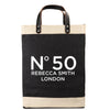 A black and beige tote bag with the text 