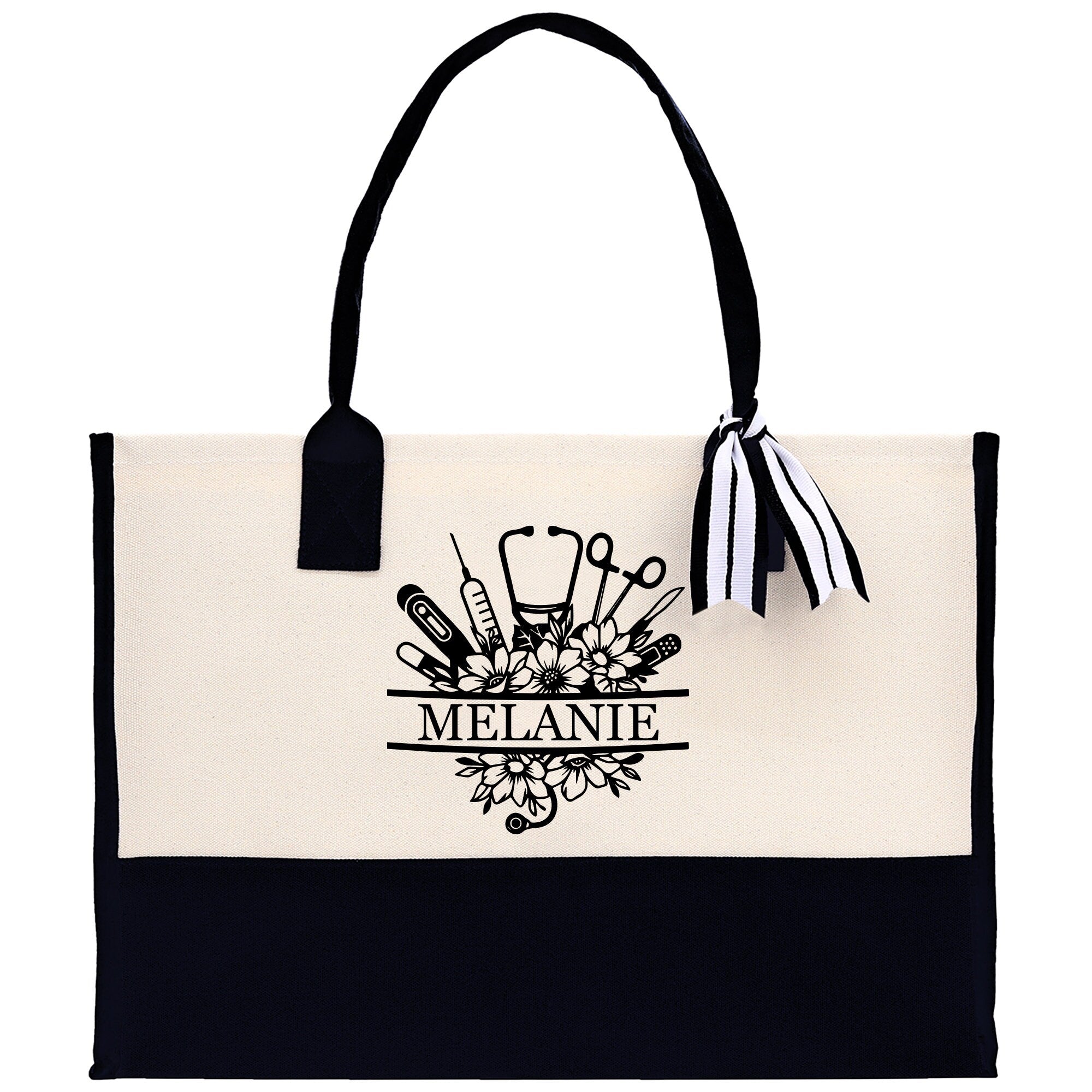 a black and white tote bag with a ribbon