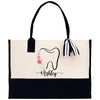 a black and white bag with a tooth on it