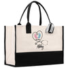 a black and white bag with a heart on it