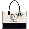 a black and white bag with a heart and flowers on it