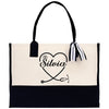 a black and white bag with a heart and name on it