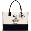 a black and white tote bag with a black and white ribbon