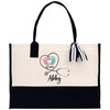 a black and white tote bag with a heart and a stethoscope