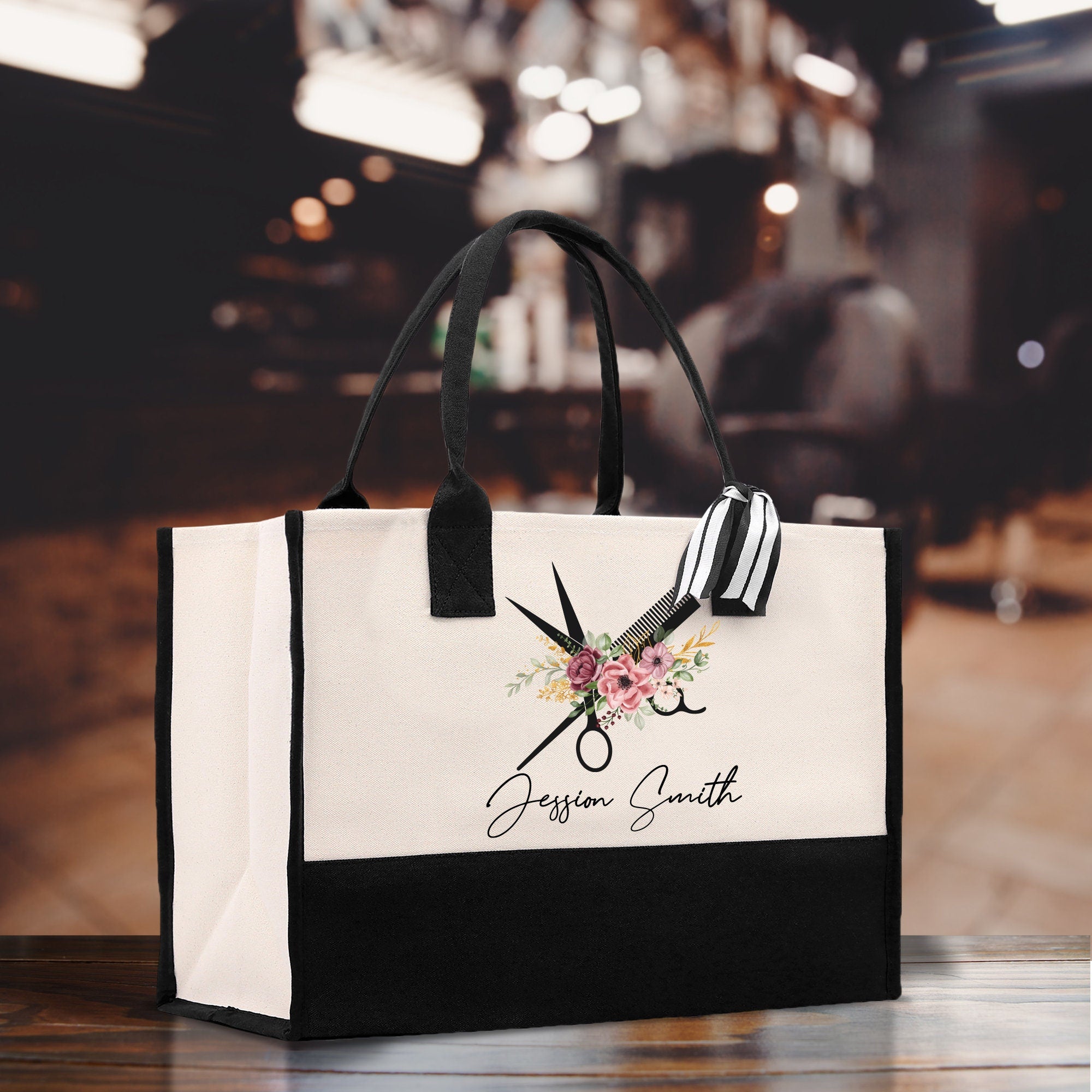 a black and white bag with scissors and flowers on it