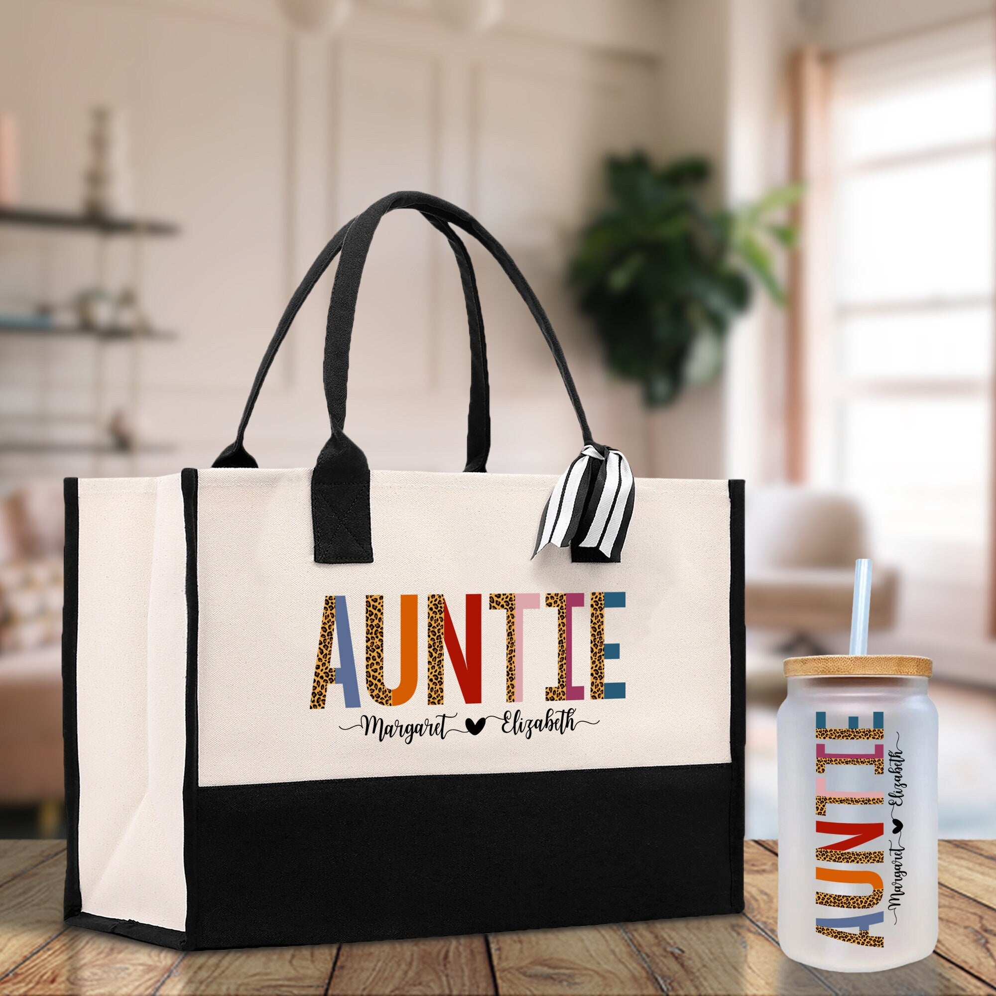 a white and black bag and a bottle on a table