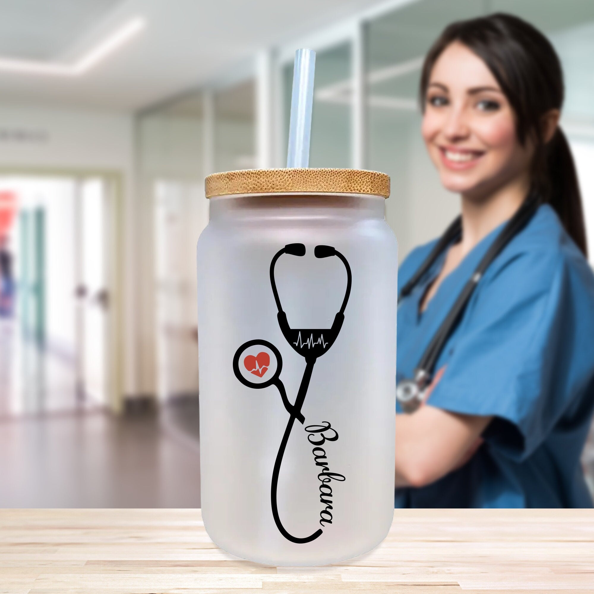 a woman with a stethoscope standing next to a medical jar