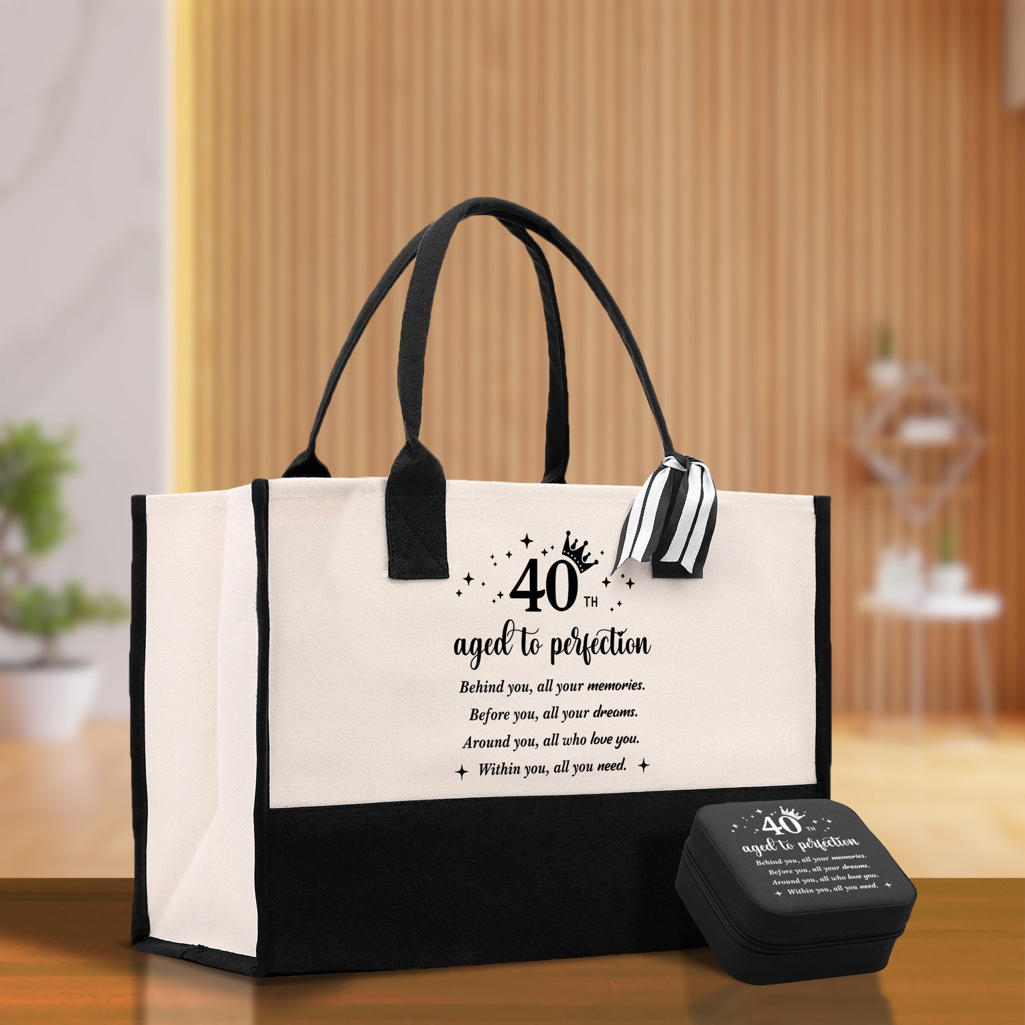 a black and white shopping bag with a quote on it