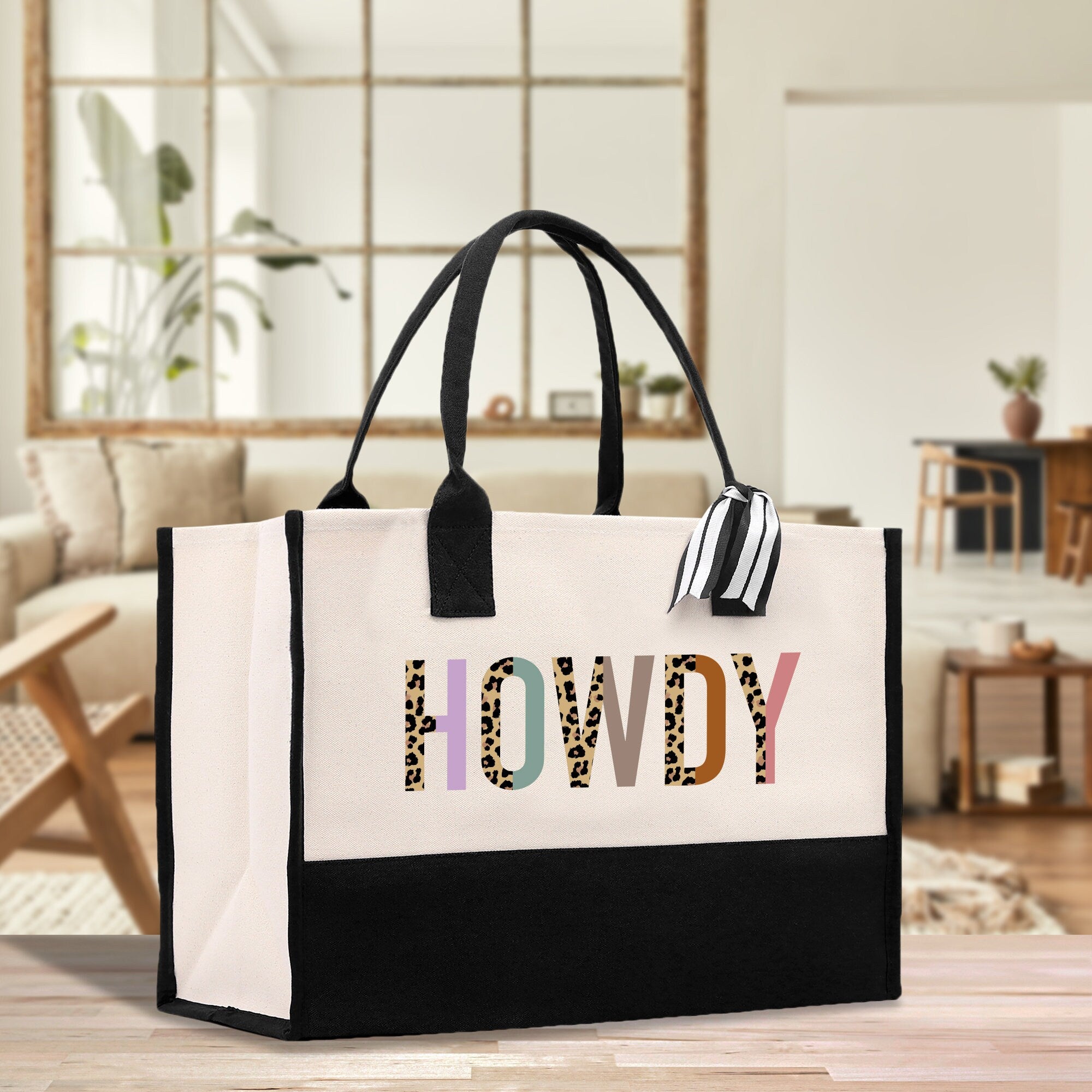 a black and white shopping bag with the words i love you printed on it