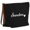 a black canvas bag with the word sandra written in white