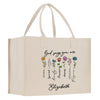 a white shopping bag with flowers on it