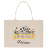a white shopping bag with a picture of flowers and butterflies on it