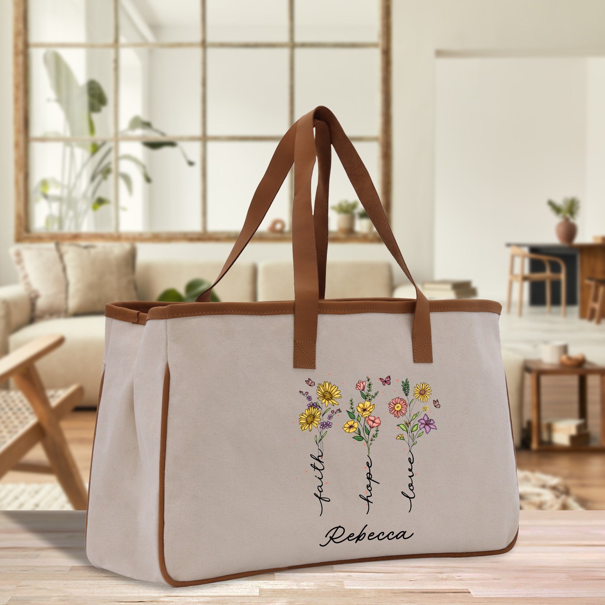 a white canvas bag with flowers painted on it