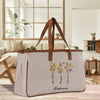 a white canvas bag with flowers painted on it