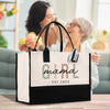 a woman is holding a shopping bag while another woman looks on