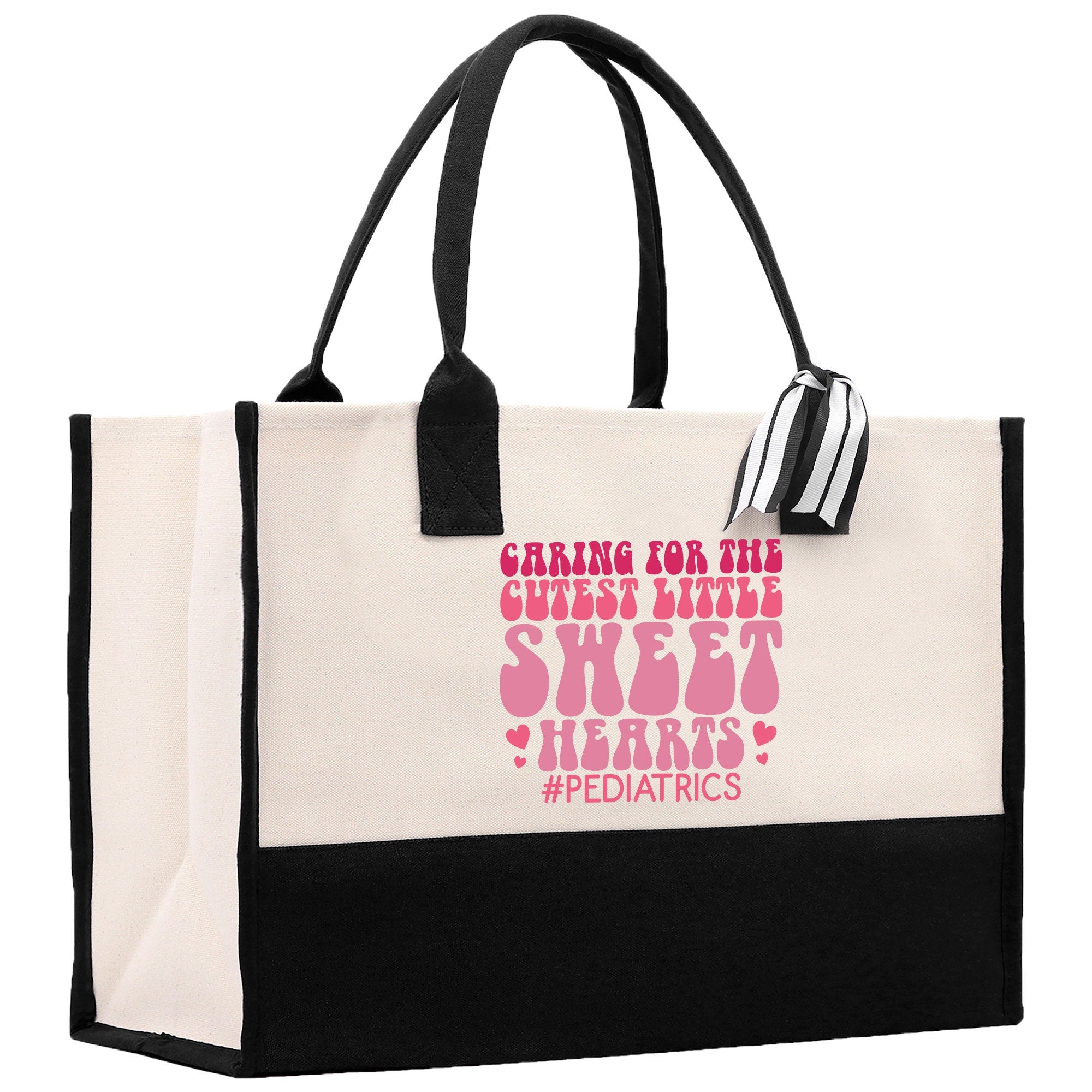 a black and white shopping bag with pink lettering