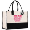 a black and white shopping bag with pink lettering