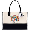a black and white tote bag with a picture of a rainbow