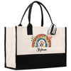 a black and white tote bag with a picture of a rainbow