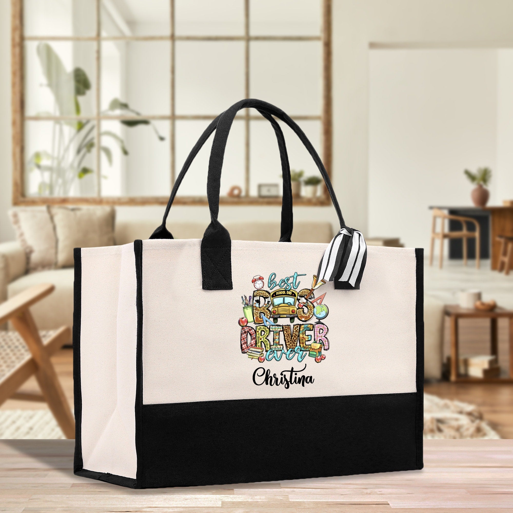 a black and white shopping bag with a cartoon character on it