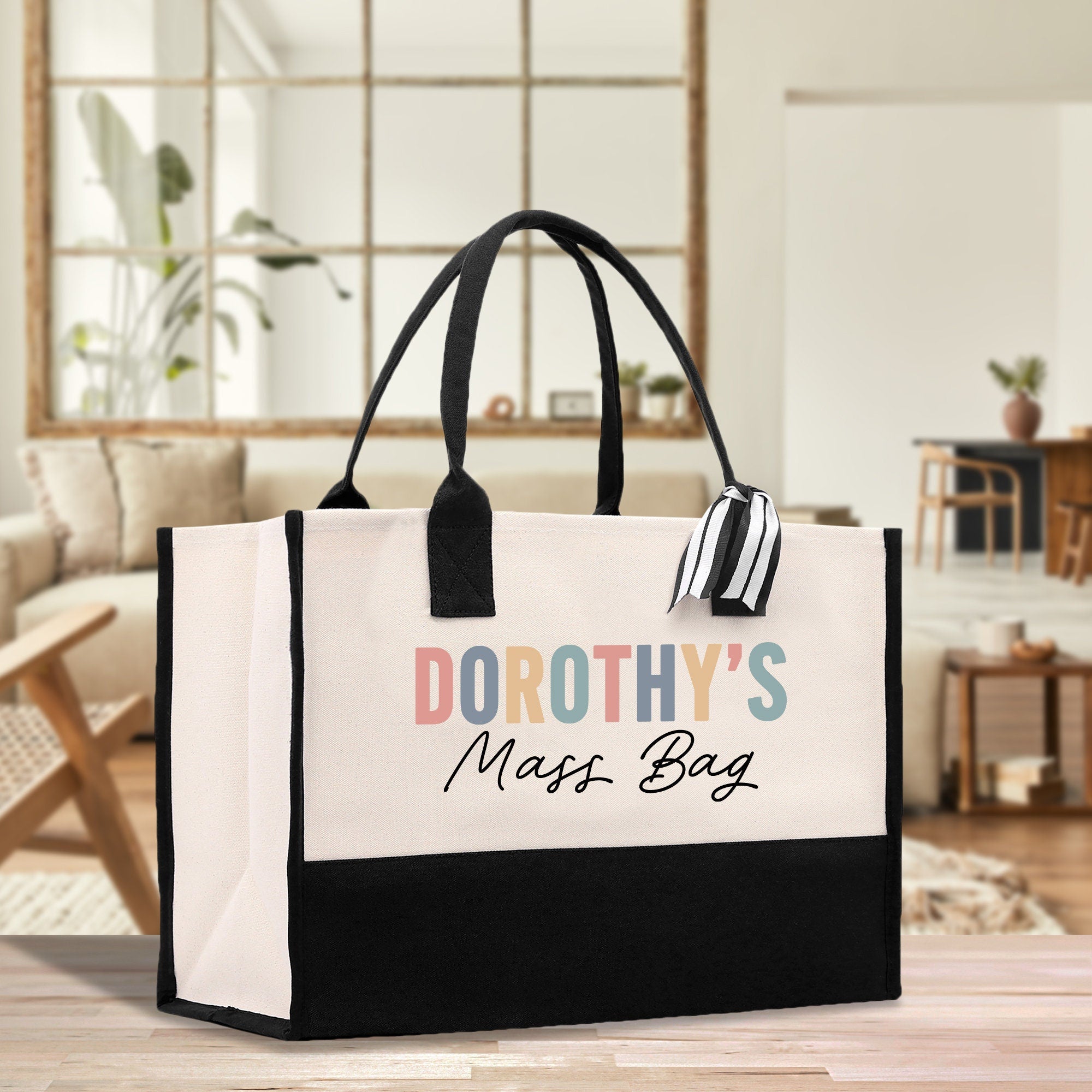 a black and white bag sitting on top of a wooden table