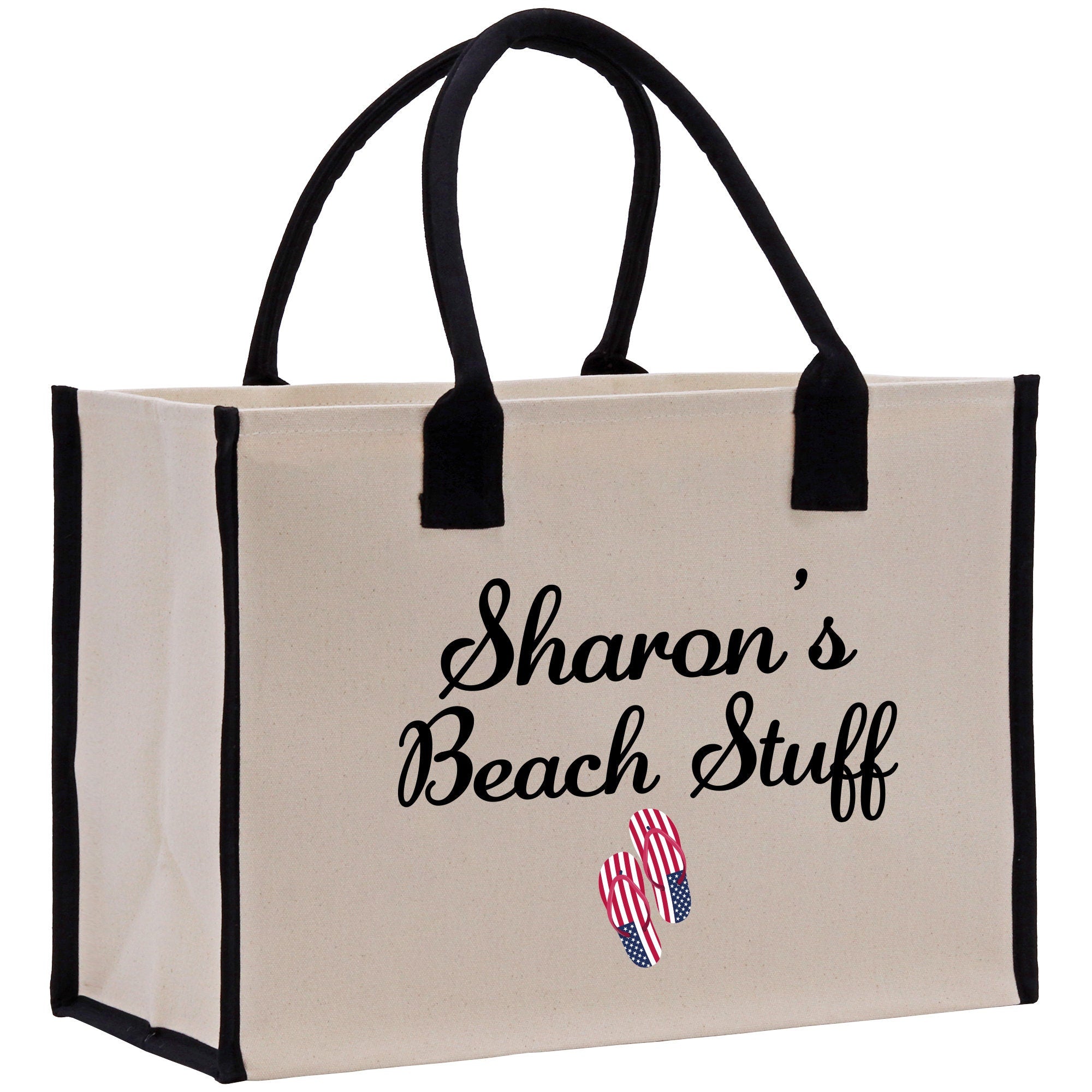 a white bag with black handles that says sharon&#39;s beach stuff