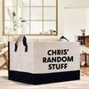 a white and black bag sitting on top of a wooden table