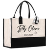 a black and white shopping bag with a name on it