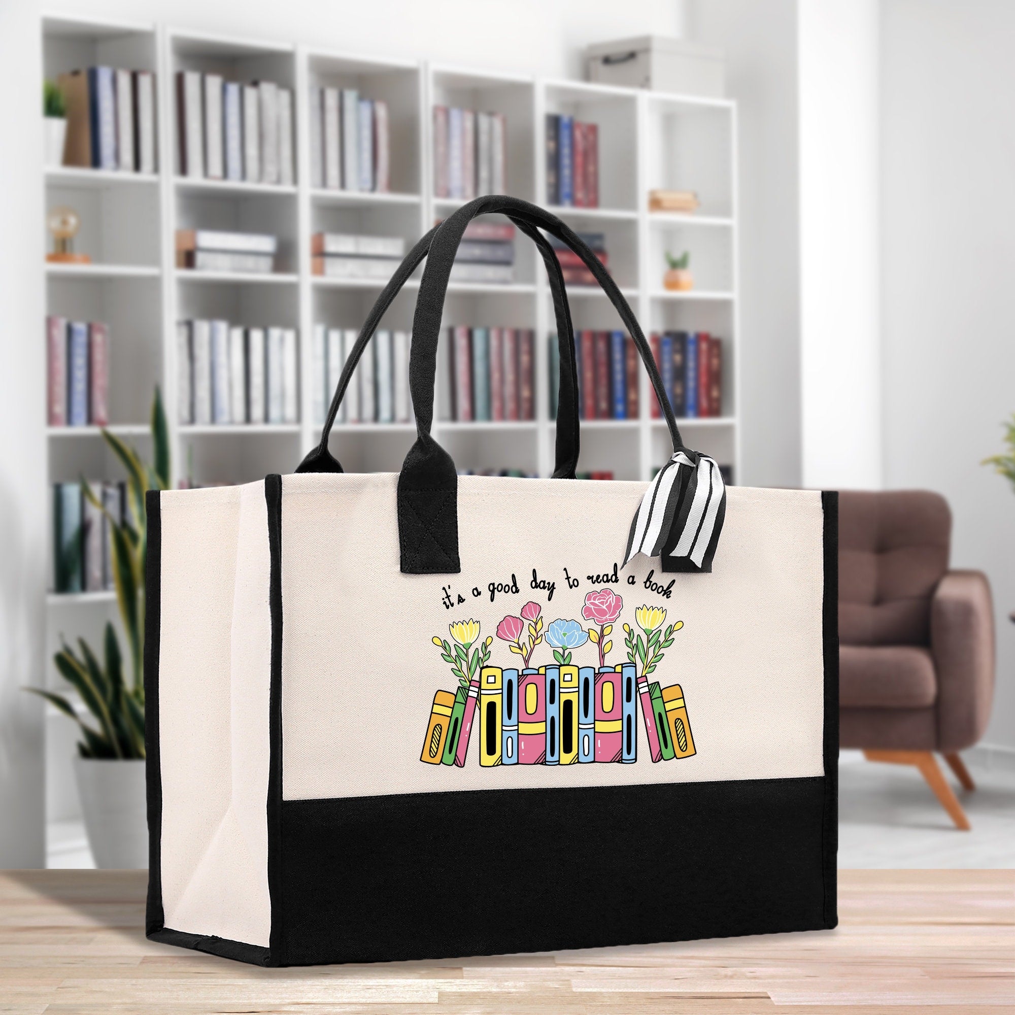 a black and white shopping bag with a picture of books on it