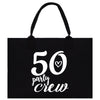 a black tote bag with the words 50 party crew printed on it