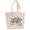 a white tote bag with flowers and the words grow in grace