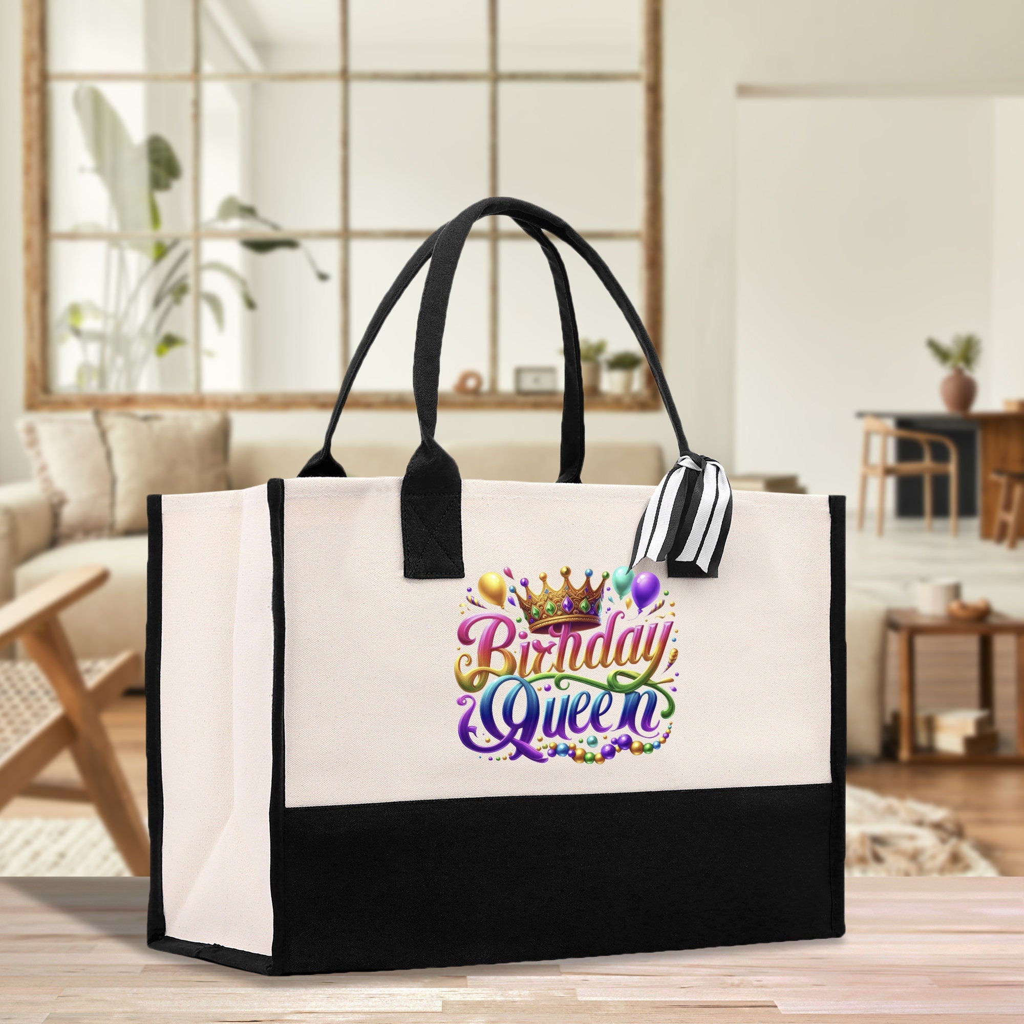 a black and white shopping bag with the words birthday queen on it