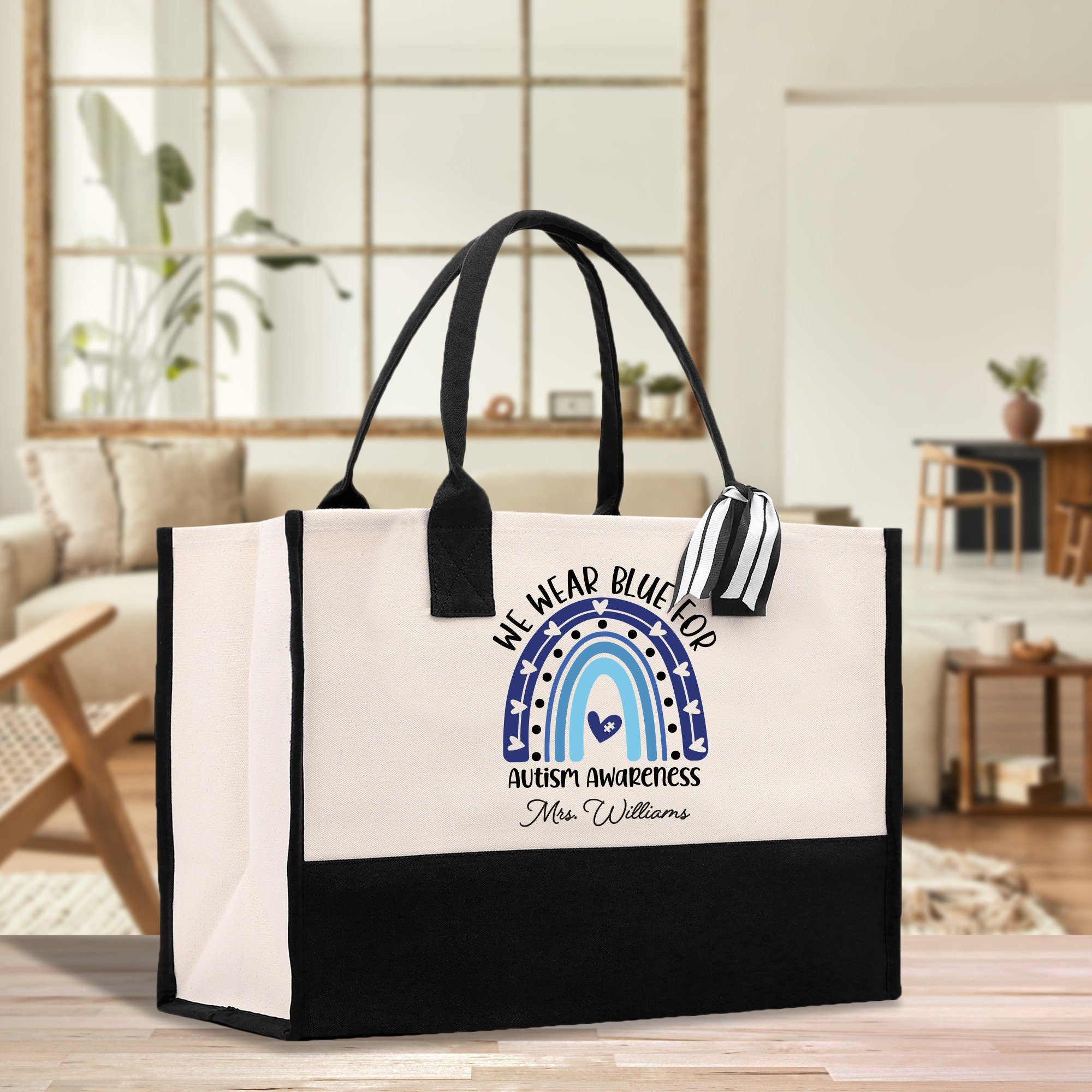 a black and white bag sitting on top of a wooden table