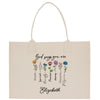 a tote bag with a bunch of flowers on it