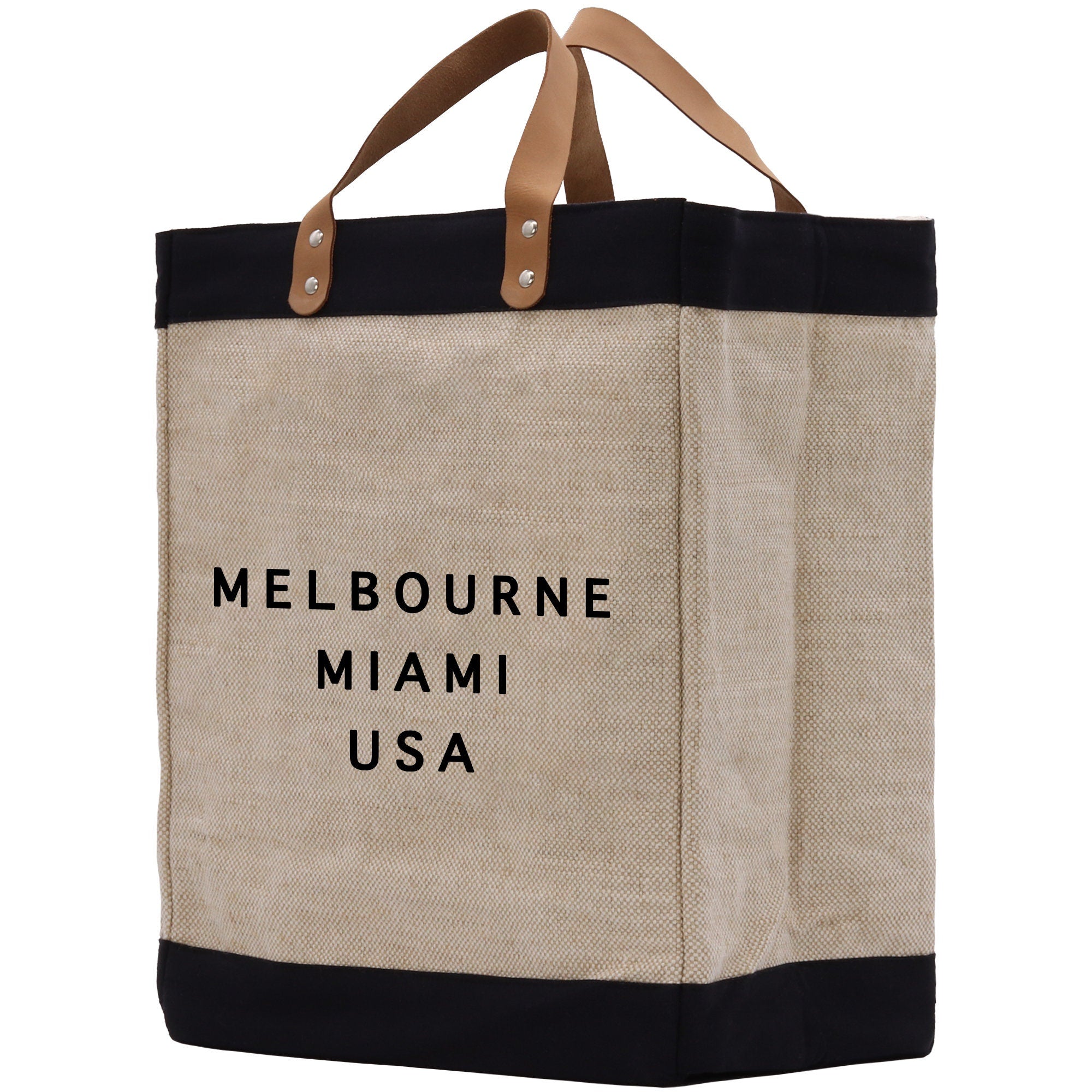 a jute bag with a black and tan handle