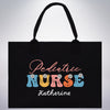 a black tote bag with the words pediatric nurse on it