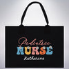 a black tote bag with the words pediatric nurse on it