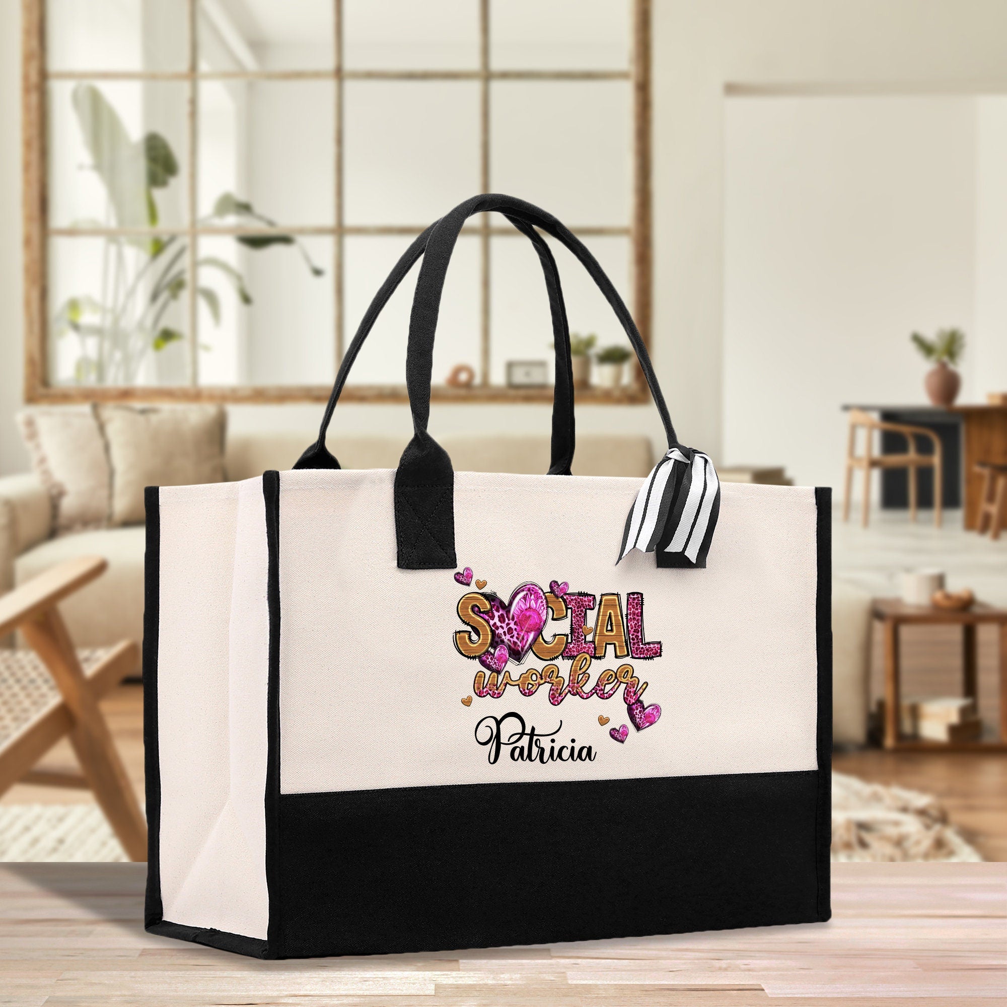 a black and white shopping bag with a floral design