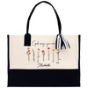 a white and black bag with flowers on it