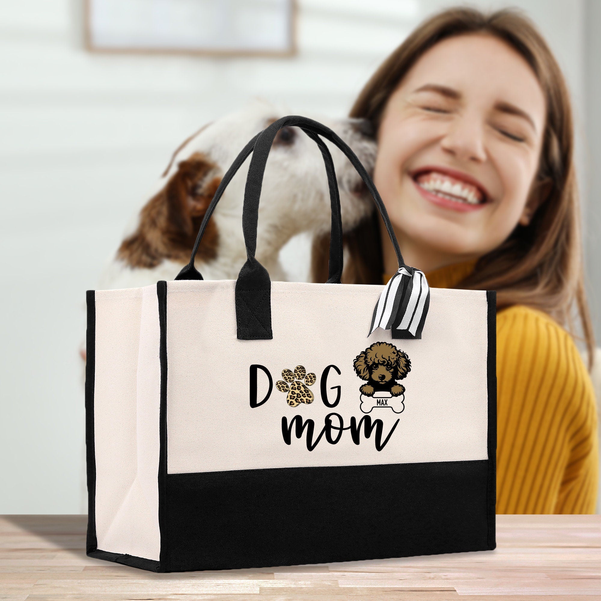 a woman sitting at a table with a dog in a bag