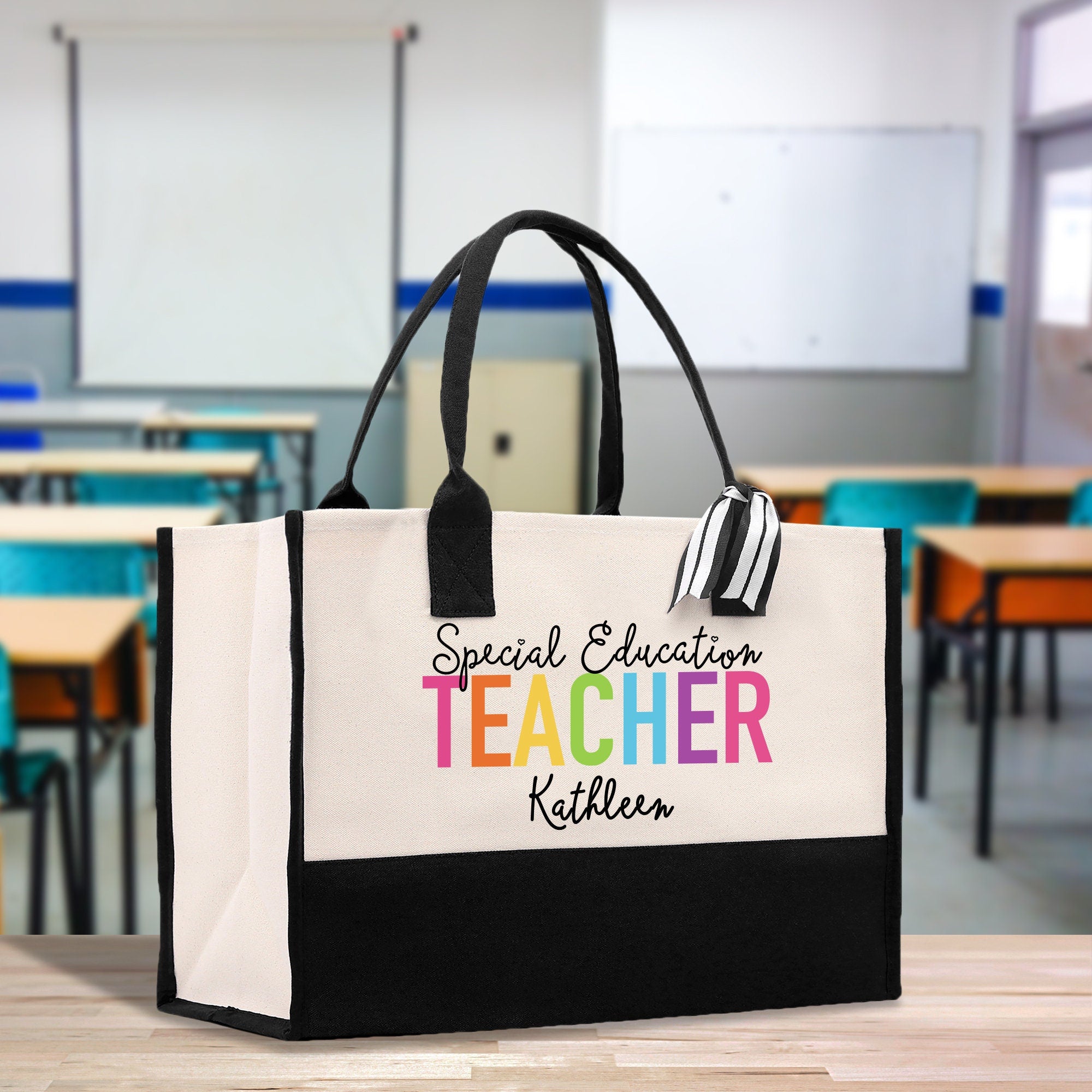 a black and white tote bag sitting on top of a table