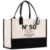 a black and white shopping bag with a floral design