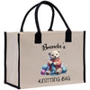 a white shopping bag with a teddy bear on it